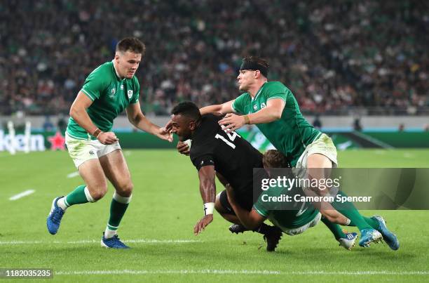 Sevu Reece of New Zealand is tackled by Jordan Larmour, Gary Ringrose and Jacob Stockdale of Ireland during the Rugby World Cup 2019 Quarter Final...