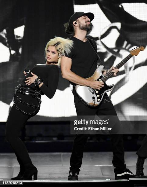 Recording artist Bebe Rexha performs with guitarist Everett Gray as they open for Jonas Brothers during a stop of the group's Happiness Begins Tour...