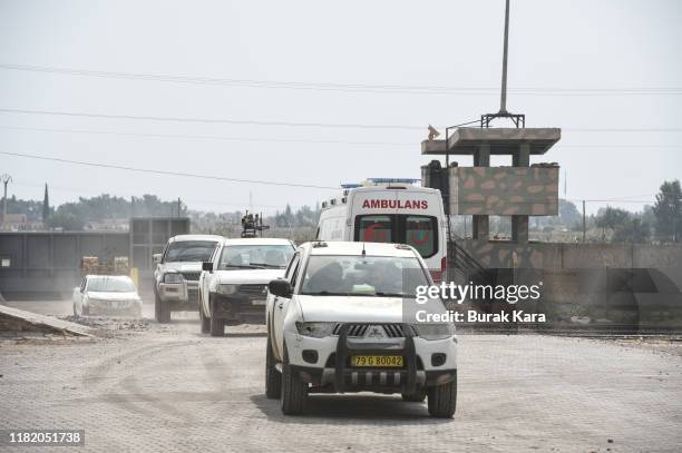 Vehicles carrying the members of Turkish-backed Free Syrian Army drive near the border on October 19, 2019 in Akcakale, Turkey. Turkish forces...