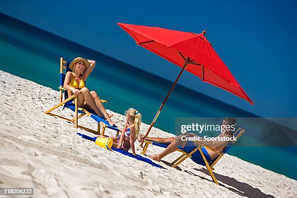 communication - a family having fun at the beach - beach florida family stockfoto's en -beelden