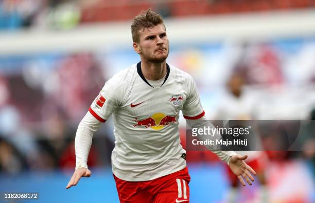 Timo Werner of RB Leipzig celebrates after scoring his team's first goal during the Bundesliga match between RB Leipzig and VfL Wolfsburg at Red Bull...