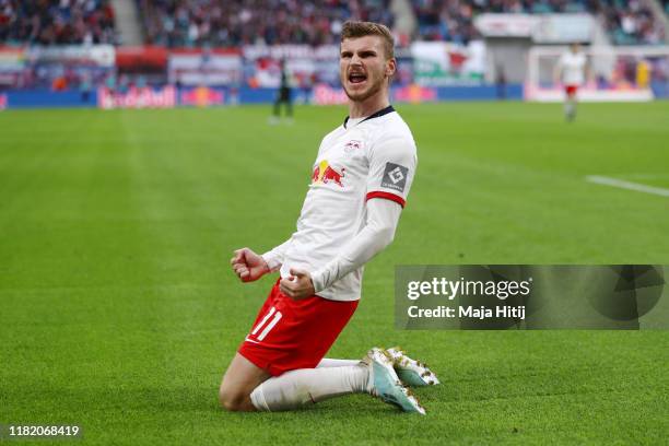 Timo Werner of RB Leipzig celebrates after scoring his team's first goal during the Bundesliga match between RB Leipzig and VfL Wolfsburg at Red Bull...