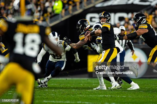 Pittsburgh Steelers quarterback Mason Rudolph looks to throw a pass to Pittsburgh Steelers wide receiver Diontae Johnson during the NFL football game...