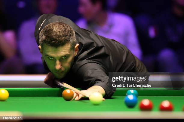 Mark Selby of England plays a shot in the semi-final match against Mark Allen of Northern Ireland on day six of 2019 English Open at K2 Leisure...