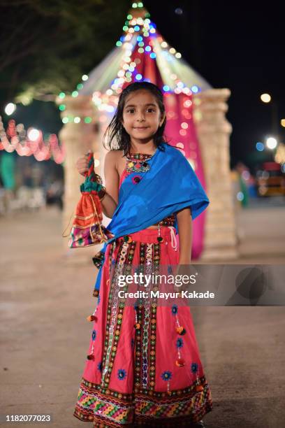 girl wearing indian traditional clothes - navratri festival celebrations stockfoto's en -beelden