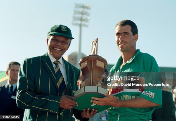 South African captain Hansie Cronje receiving the Trophy from South African President Nelson Mandela after the Seventh Benson and Hedges One Day...