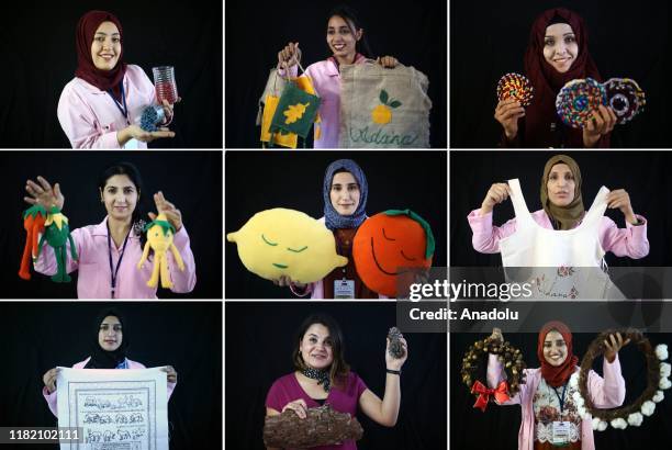 Syrian and Turkish women hold handiworks, made in a course on art works, handcrafts and souvenir production, within a cooperative project named...