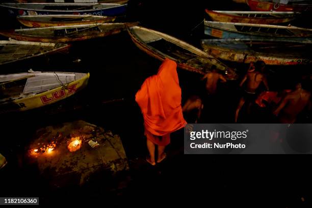 Hindu devotees bath on the river Ganga on the day of Dev Deepawali in Varanasi, India, 12 November, 2019. Dev Deepawali is the festival of Kartik...
