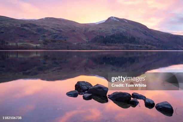 Beautiful autumn sunrise is reflected in Thirlmere in the Lake District on November 13, 2019 in Ambleside, England. Temperatures continue to drop...