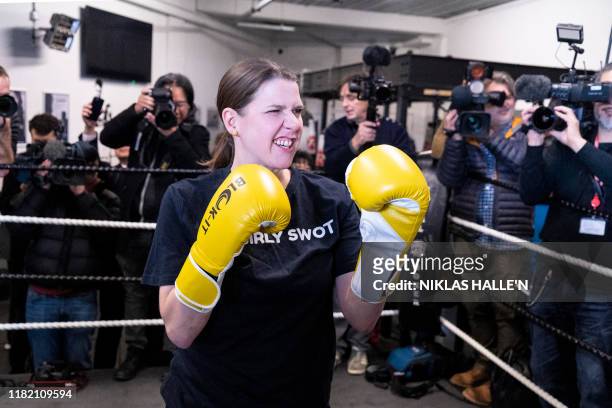 Britian's Liberal Democrats leader Jo Swinson poses as she takes a boxing lesson at Total Boxer, a boxing gym offering training to young people as a...