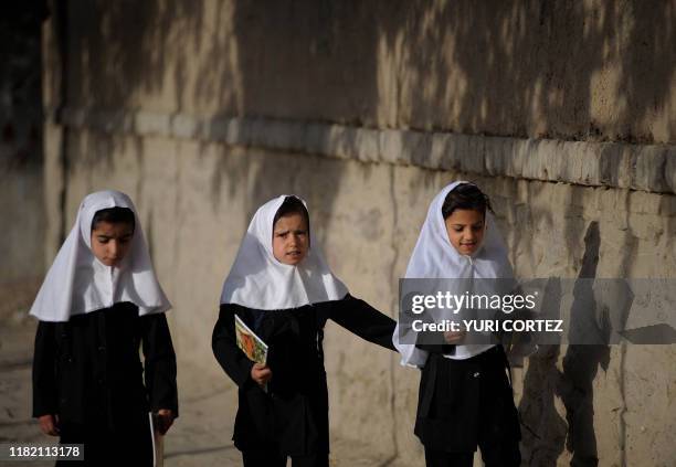 Afghans schoolgirls walk to school in Old Kabul on August 25, 2010. The United Nations estimates that more than 80 percent of females and around 50...