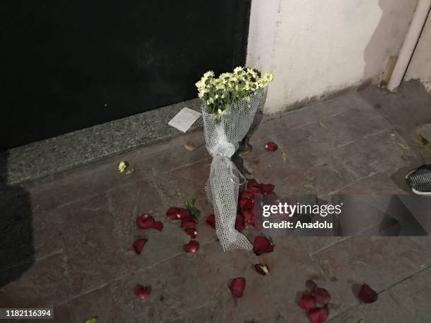 Note and a bouquet of flowers are left at a door step after former British military intelligence officer James Gustaf Edward Le Mesurier was found...