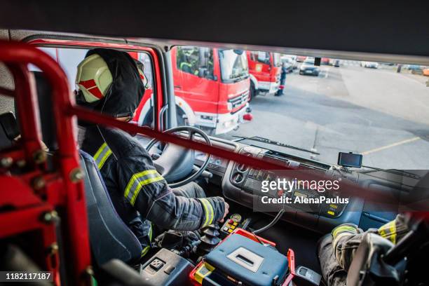 firefighter driving a fire truck top view - driving course stock pictures, royalty-free photos & images