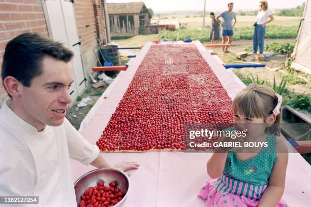 French pastrymaker Bernard Labatut created the 4.78 meter long by 1.20 meter wide biggest strawberry cake evermade to post a Guiness world recording,...