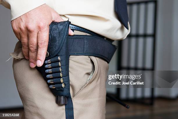 handgun and bullets holstered at waist of a security guard - police training stock pictures, royalty-free photos & images