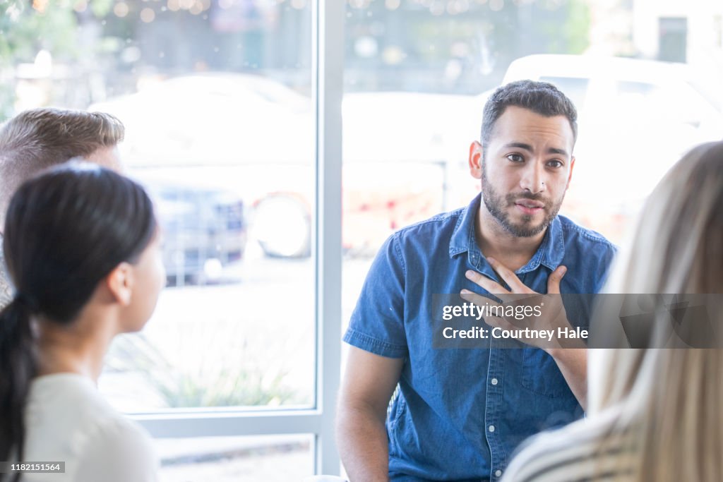 Man talking during a support group meeting