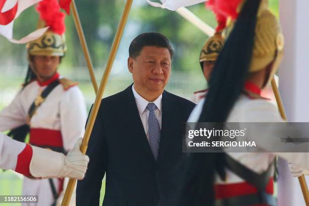 China's President Xi Jinping arrives for a bilateral meeting with Brazil's President Jair Bolsonaro ahead of the 11th edition of the BRICS Summit, on...