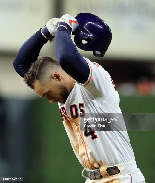 George Springer of the Houston Astros reacts after grounding into an inning ending double play against the New York Yankees during the fifth inning...