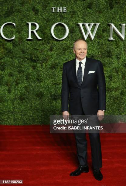 British actor Jason Watkins poses on the red carpet upon arrival for the World premiere of the television series "The Crown - Series 3" in London on...