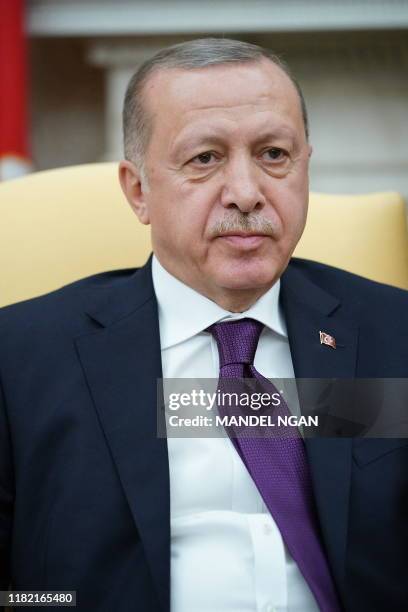 Turkey's President Recep Tayyip Erdo?an takes part in a meeting in the Oval Office with US President Donald Trump at the White House in Washington,...