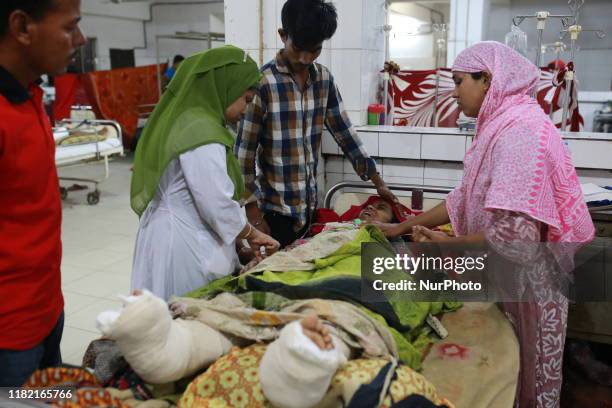 An injured woman is treated at Pangu Hospital after an intercity train collided into another train in Brahmanbaria, Bangladesh on November 13, 2019....