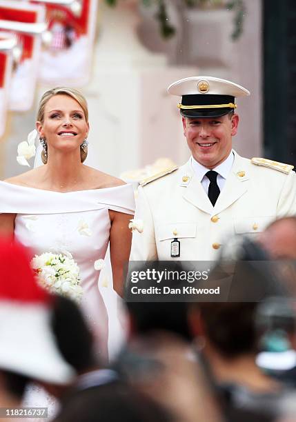 Princess Charlene of Monaco and Prince Albert II of Monaco leave the religious ceremony of the Royal Wedding of Prince Albert II of Monaco to...