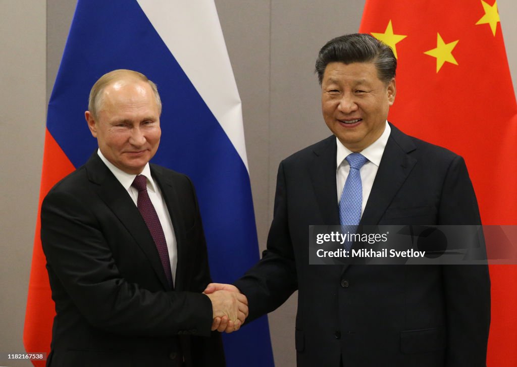 Russian President Vladimir Putin meets Chinese President Xi Jinping at BRICS Summit in Brasilia