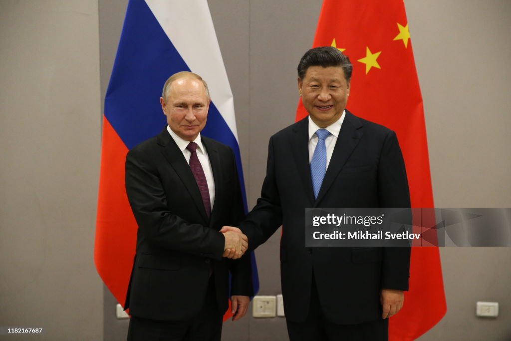Russian President Vladimir Putin meets Chinese President Xi Jinping at BRICS Summit in Brasilia