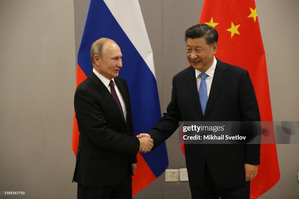 Russian President Vladimir Putin meets Chinese President Xi Jinping at BRICS Summit in Brasilia