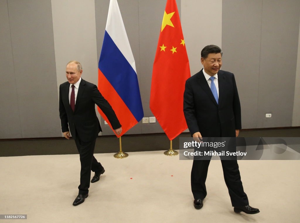 Russian President Vladimir Putin meets Chinese President Xi Jinping at BRICS Summit in Brasilia