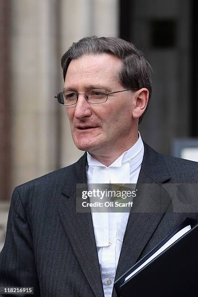 Attorney General Dominic Grieve leaves the High Court where he claimed two national newspapers published articles which were in contempt of court on...