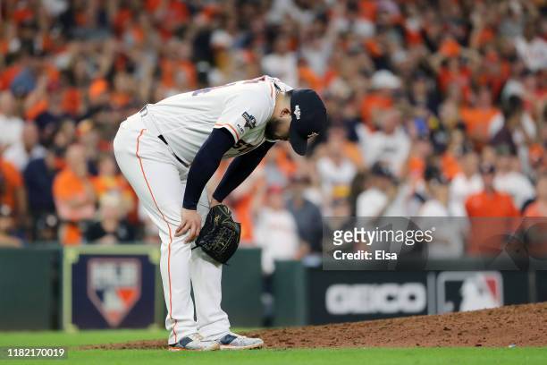 Roberto Osuna of the Houston Astros reacts after he allows a game-tying two-run home run to DJ LeMahieu of the New York Yankees during the ninth...