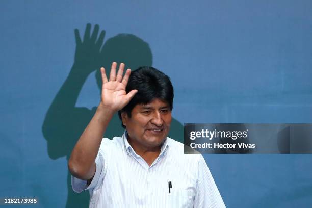 Former President of Bolivia Evo Morales waves during an event to distinguish him as honorary guest at City Hall on November 13, 2019 in Mexico City,...