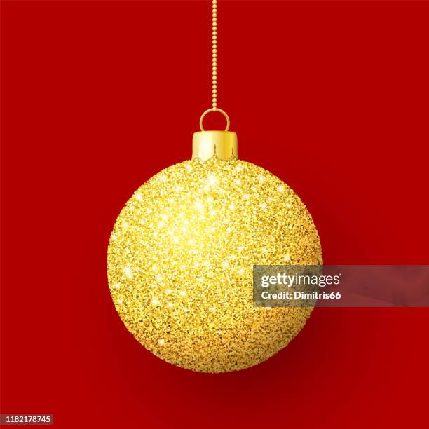 gold glitter shiny christmas ball on red background - sequins stock illustrations
