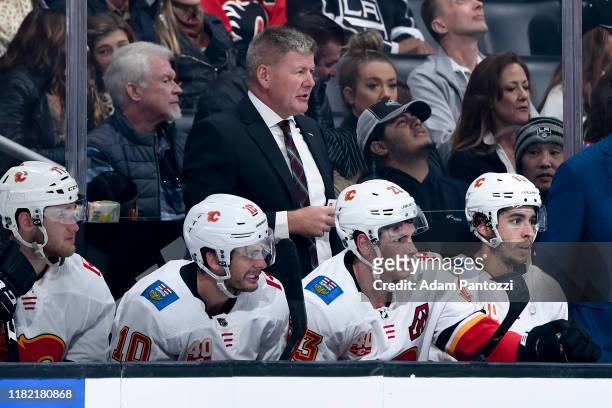 Head coach Bill Peters of the Calgary Flames looks on from the bench during the first period of the game against the Los Angeles Kings at STAPLES...