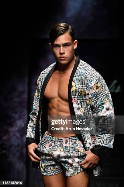 Model walks the runway wearing Kenneth Barlis during Los Angeles Fashion Week SS/20 Powered by Art Hearts Fashion on October 19, 2019 in Los Angeles,...