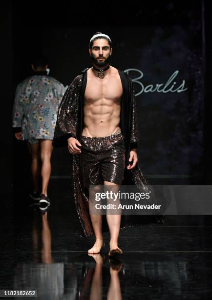 Model walks the runway wearing Kenneth Barlis during Los Angeles Fashion Week SS/20 Powered by Art Hearts Fashion on October 19, 2019 in Los Angeles,...