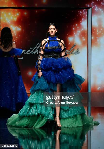 Model walks the runway wearing Kenneth Barlis during Los Angeles Fashion Week SS/20 Powered by Art Hearts Fashion on October 19, 2019 in Los Angeles,...