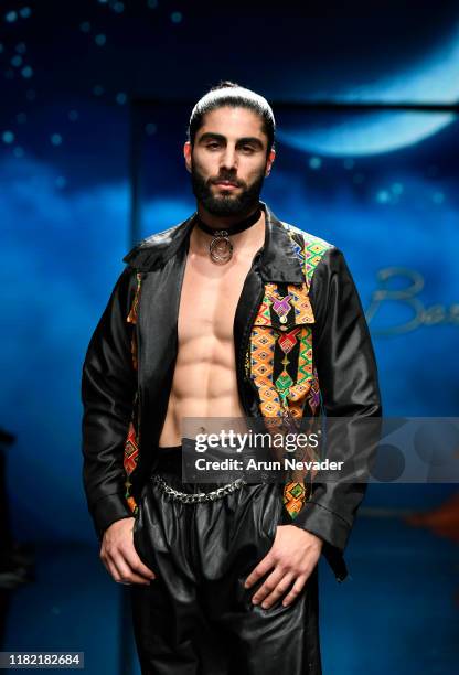 Model walks the runway wearing Kenneth Barlis during Los Angeles Fashion Week SS/20 Powered by Art Hearts Fashion on October 19, 2019 in Los Angeles,...