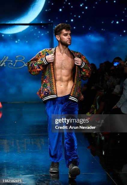 Model walks the runway wearing Kenneth Barlis during Los Angeles Fashion Week SS/20 Powered by Art Hearts Fashion on October 19, 2019 in Los Angeles,...