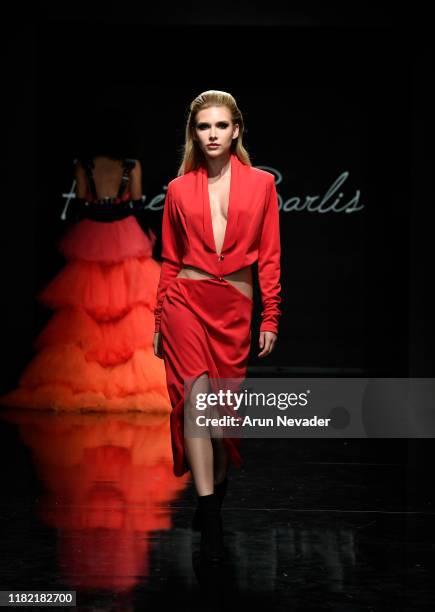 Model walks the runway wearing Kenneth Barlis during Los Angeles Fashion Week SS/20 Powered by Art Hearts Fashion on October 19, 2019 in Los Angeles,...