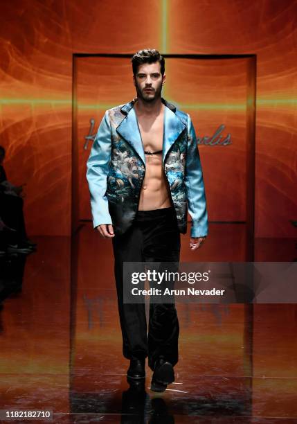 Model walks the runway wearing Kenneth Barlis during Los Angeles Fashion Week SS/20 Powered by Art Hearts Fashion on October 19, 2019 in Los Angeles,...