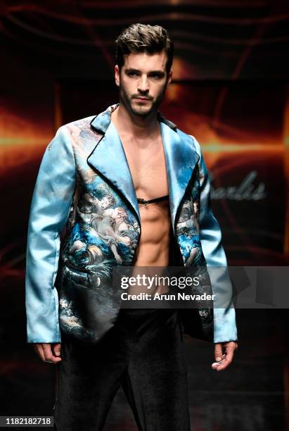 Model walks the runway wearing Kenneth Barlis during Los Angeles Fashion Week SS/20 Powered by Art Hearts Fashion on October 19, 2019 in Los Angeles,...