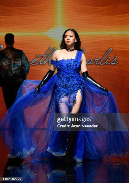 Model walks the runway wearing Kenneth Barlis during Los Angeles Fashion Week SS/20 Powered by Art Hearts Fashion on October 19, 2019 in Los Angeles,...