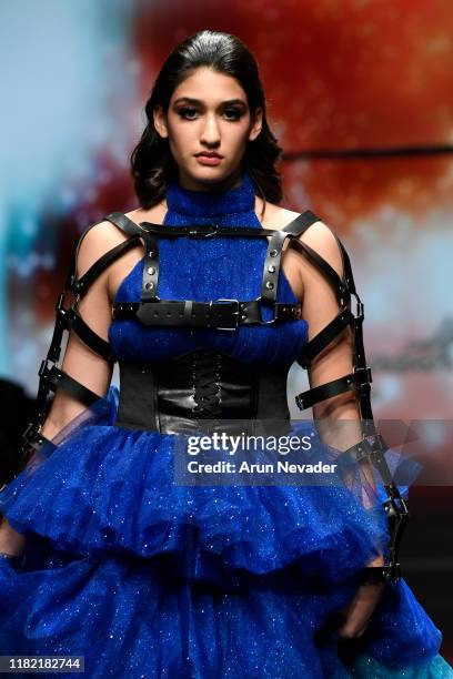 Model walks the runway wearing Kenneth Barlis during Los Angeles Fashion Week SS/20 Powered by Art Hearts Fashion on October 19, 2019 in Los Angeles,...