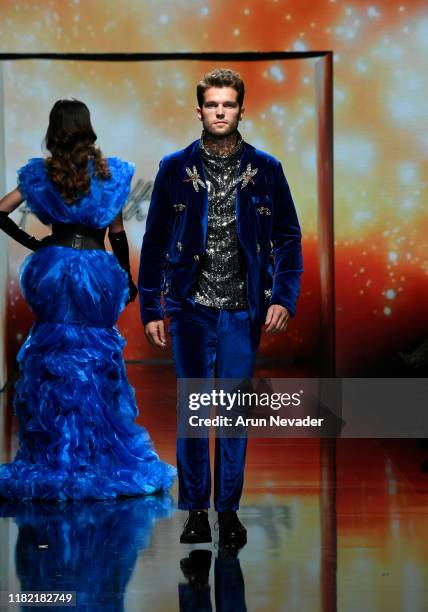 Model walks the runway wearing Kenneth Barlis during Los Angeles Fashion Week SS/20 Powered by Art Hearts Fashion on October 19, 2019 in Los Angeles,...