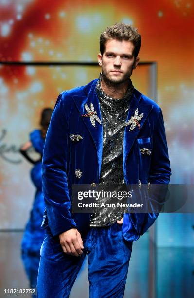 Model walks the runway wearing Kenneth Barlis during Los Angeles Fashion Week SS/20 Powered by Art Hearts Fashion on October 19, 2019 in Los Angeles,...