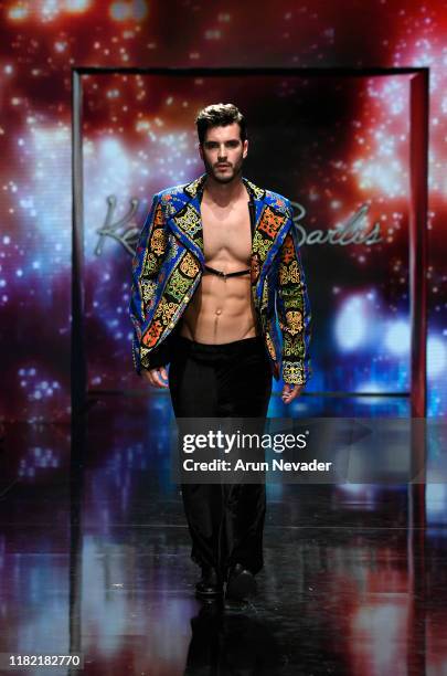 Model walks the runway wearing Kenneth Barlis during Los Angeles Fashion Week SS/20 Powered by Art Hearts Fashion on October 19, 2019 in Los Angeles,...