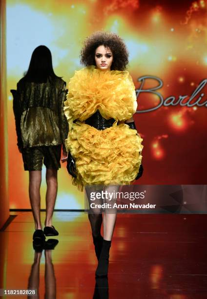 Model walks the runway wearing Kenneth Barlis during Los Angeles Fashion Week SS/20 Powered by Art Hearts Fashion on October 19, 2019 in Los Angeles,...