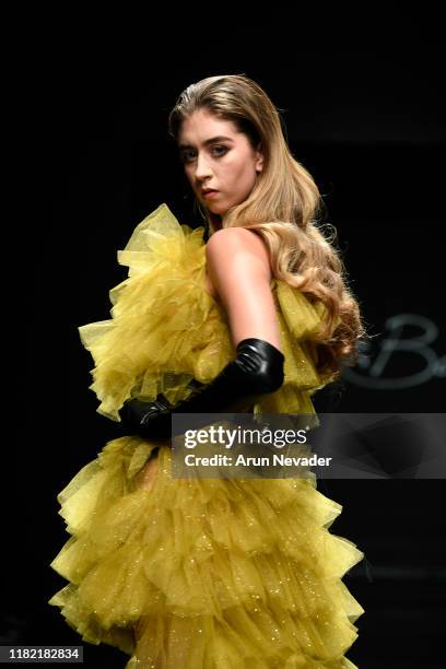 Model walks the runway wearing Kenneth Barlis during Los Angeles Fashion Week SS/20 Powered by Art Hearts Fashion on October 19, 2019 in Los Angeles,...